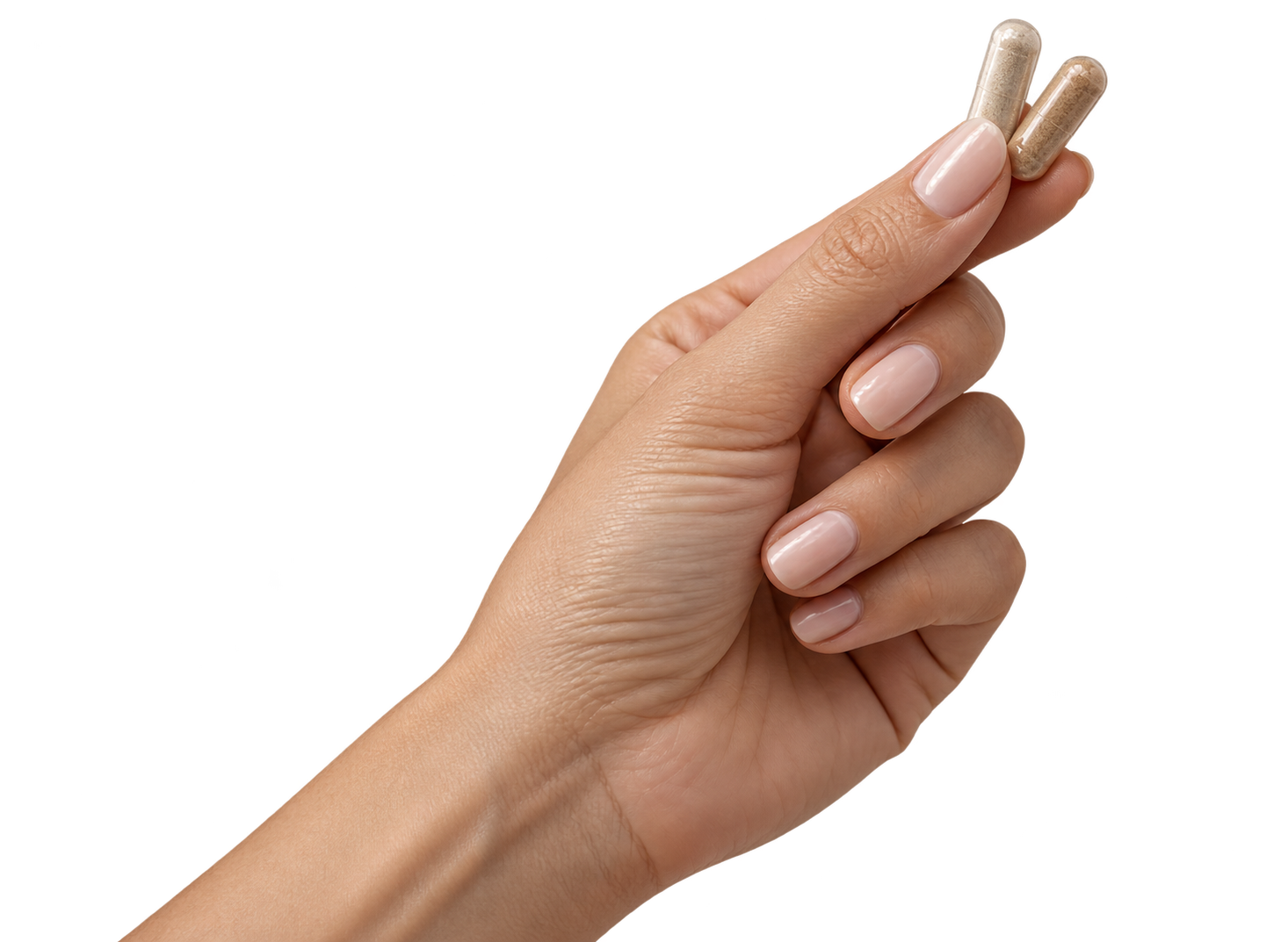 Hand holding two capsules as part of a simple day-and-night supplement routine.